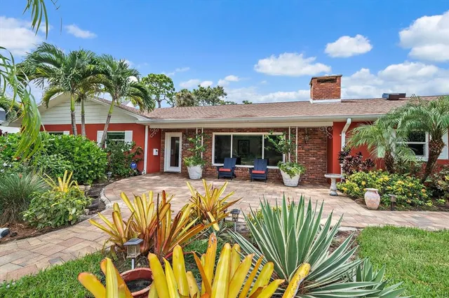 a view of a patio with a table and chairs
