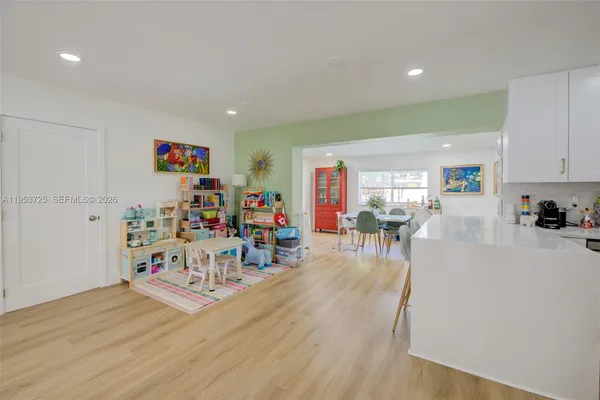 a kitchen with stainless steel appliances a microwave a sink and a refrigerator