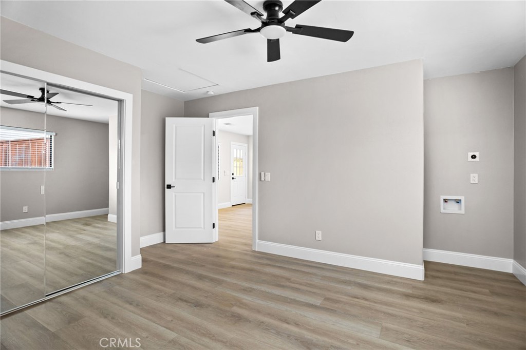 29566 Big Range Road, Unit 2 Canyon Lake, CA 92587 - Photo 13 of 27 a view of an empty room and wooden floor