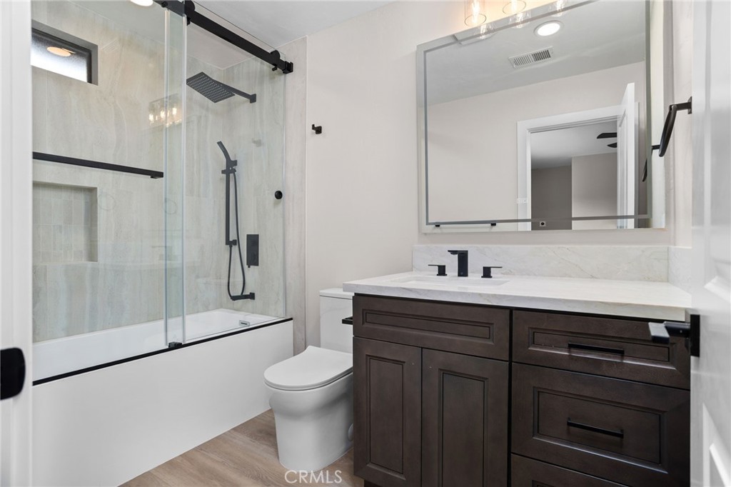 29566 Big Range Road, Unit 2 Canyon Lake, CA 92587 - Photo 14 of 27 a bathroom with a sink a toilet and shower