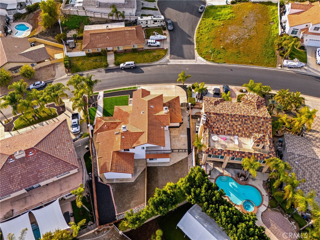 29566 Big Range Road, Unit 2 Canyon Lake, CA 92587 - Photo 23 of 27 an aerial view of a house with a yard and a fountain