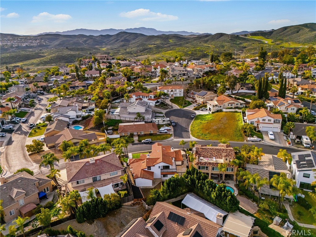 29566 Big Range Road, Unit 2 Canyon Lake, CA 92587 - Photo 24 of 27 an aerial view of residential houses with outdoor space