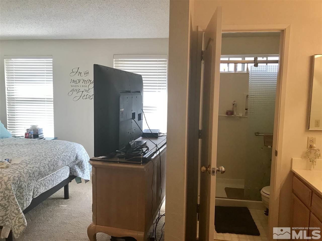 6396 Chesterfield Lane Reno, NV 89523 - Photo 13 of 21 a bedroom with a bed and a walk in closet