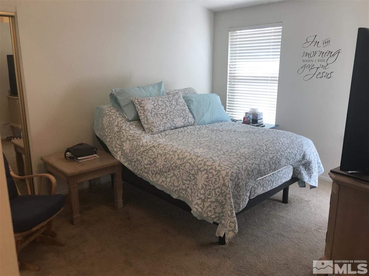 6396 Chesterfield Lane Reno, NV 89523 - Photo 15 of 21 a bedroom with a bed and a window