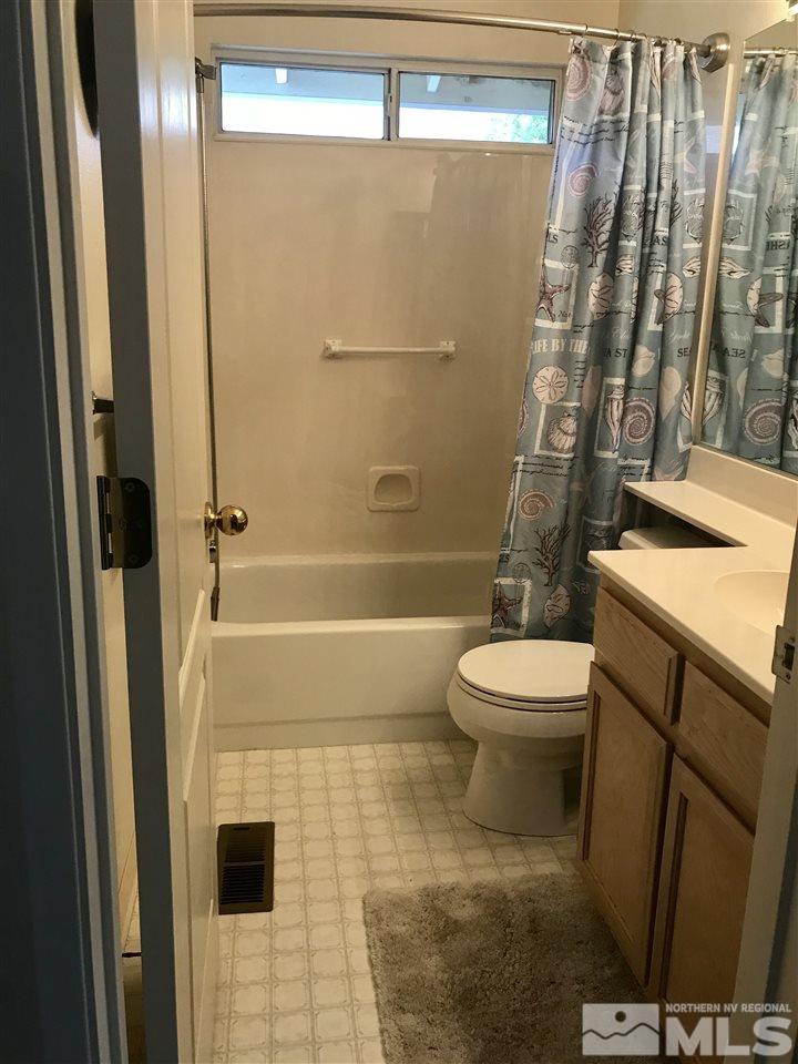 6396 Chesterfield Lane Reno, NV 89523 - Photo 19 of 21 a bathroom with a toilet and a shower