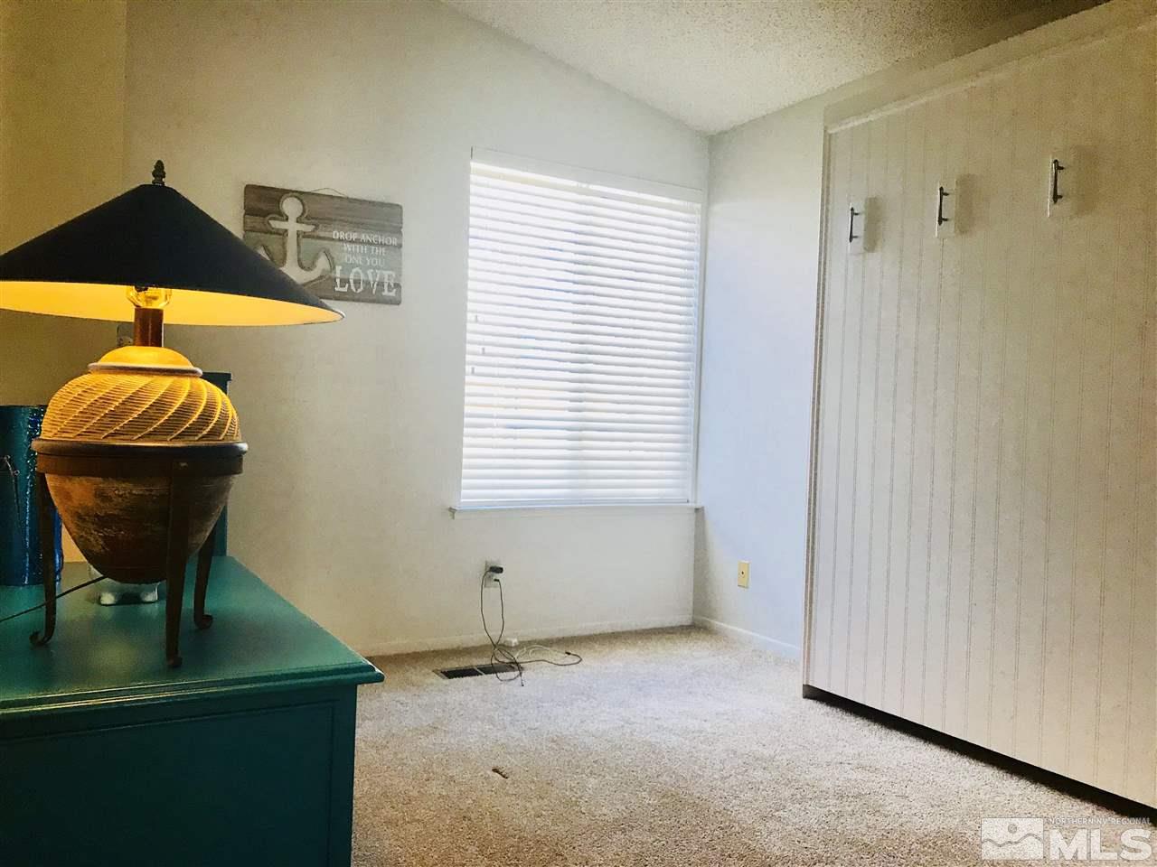 6396 Chesterfield Lane Reno, NV 89523 - Photo 20 of 21 a room with a window and a table