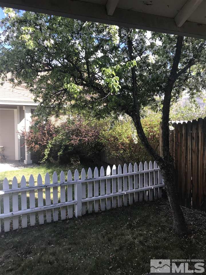 6396 Chesterfield Lane Reno, NV 89523 - Photo 2 of 21 a view of a yard with wooden fence