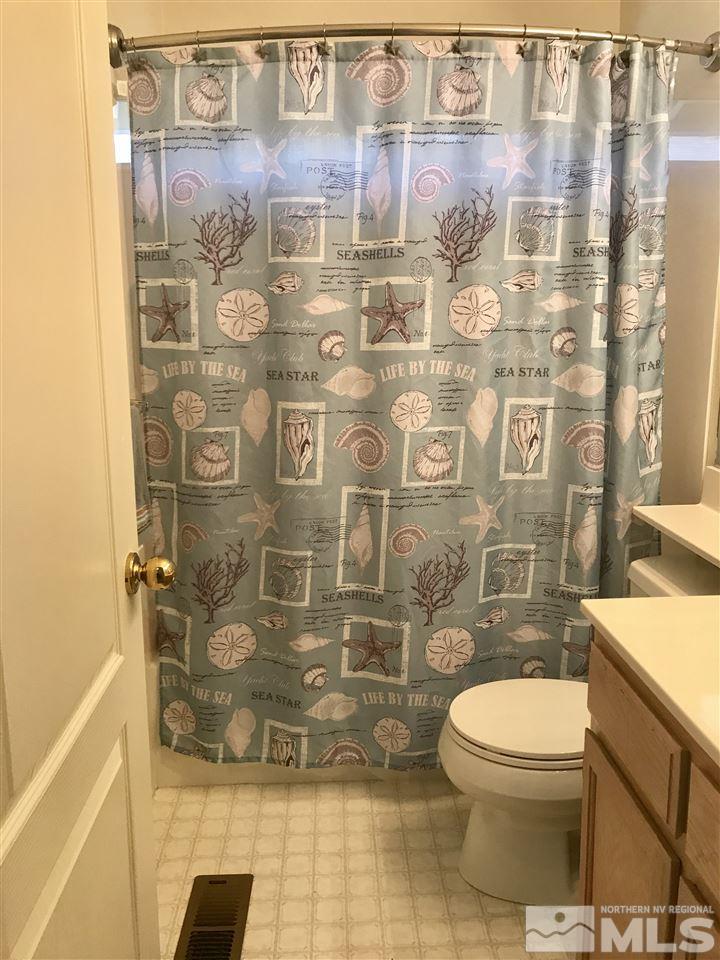 6396 Chesterfield Lane Reno, NV 89523 - Photo 21 of 21 a bathroom with a toilet and shower
