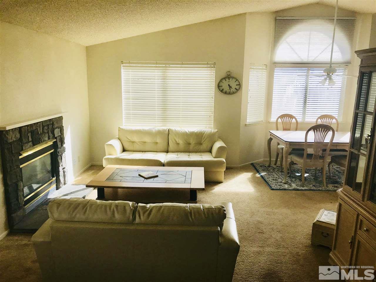 6396 Chesterfield Lane Reno, NV 89523 - Photo 3 of 21 a living room with furniture and a fireplace