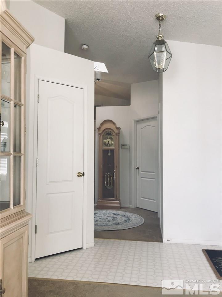 6396 Chesterfield Lane Reno, NV 89523 - Photo 7 of 21 a view of a entryway door with hallway