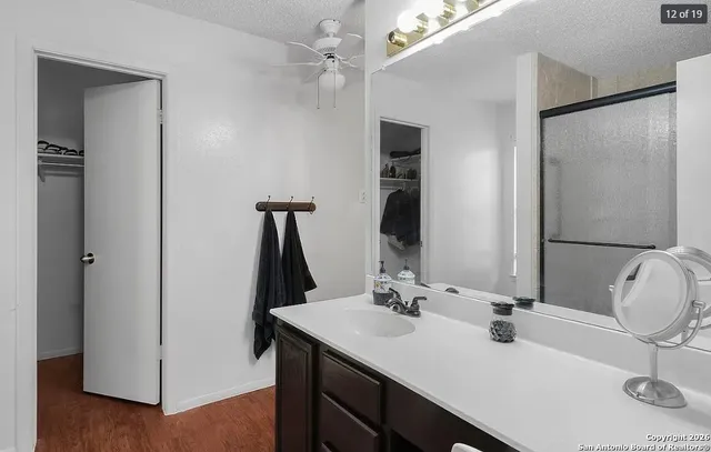 a bathroom with a double vanity sink a and mirror