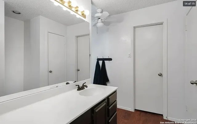 a bathroom with a sink and a mirror