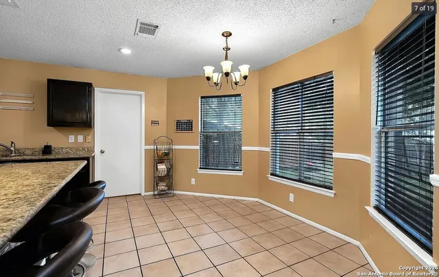 a view of a kitchen cabinets and a kitchen counter top space