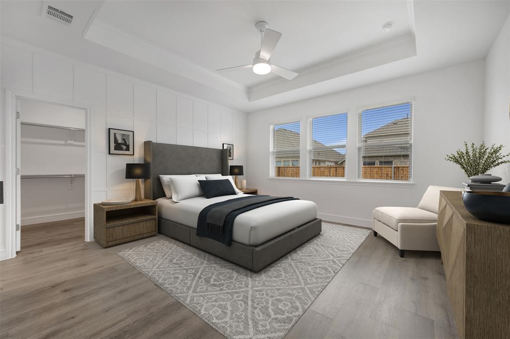 1004 Ashcroft Lane Justin, TX 76247 - Photo 10 of 39 a bedroom with a large bed and a couch