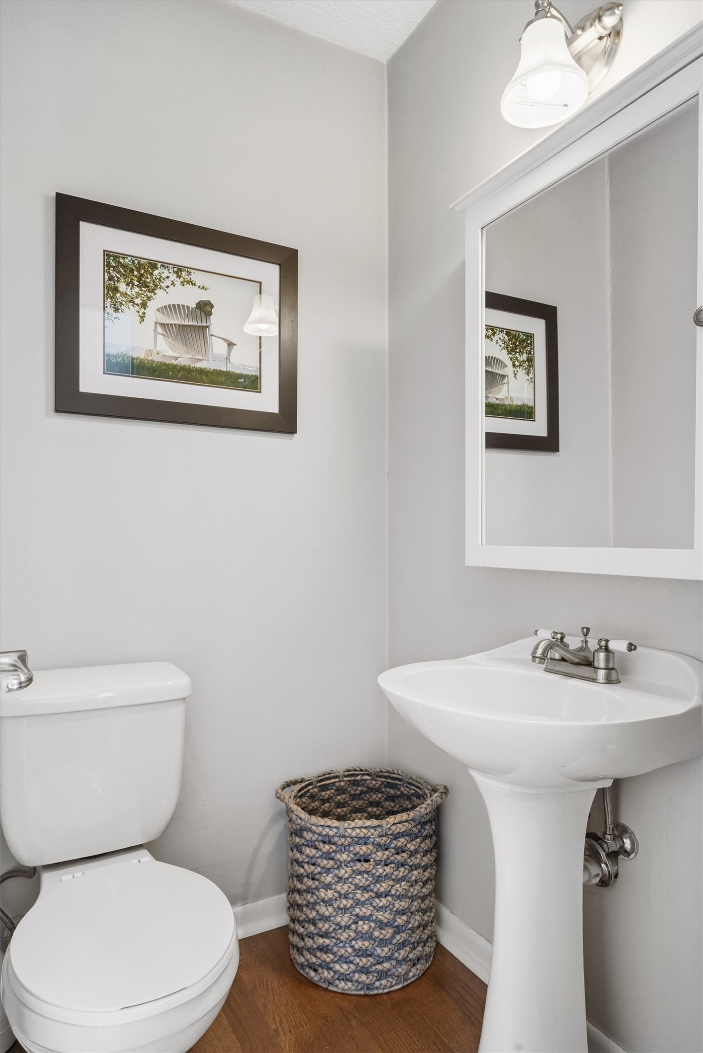 1507 Wethersfield Road Austin, TX 78703 - Photo 29 of 40 a bathroom with a toilet a sink and mirror