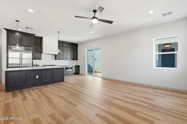 a view of kitchen with sink and wooden floor