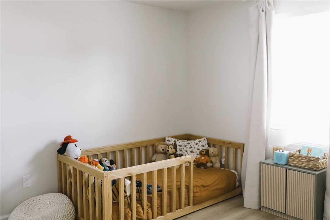 314 Callie Way Easley, SC 29642 - Photo 5 of 27 This cozy bedroom features a crib and bright window, creating a serene and inviting atmosphere.