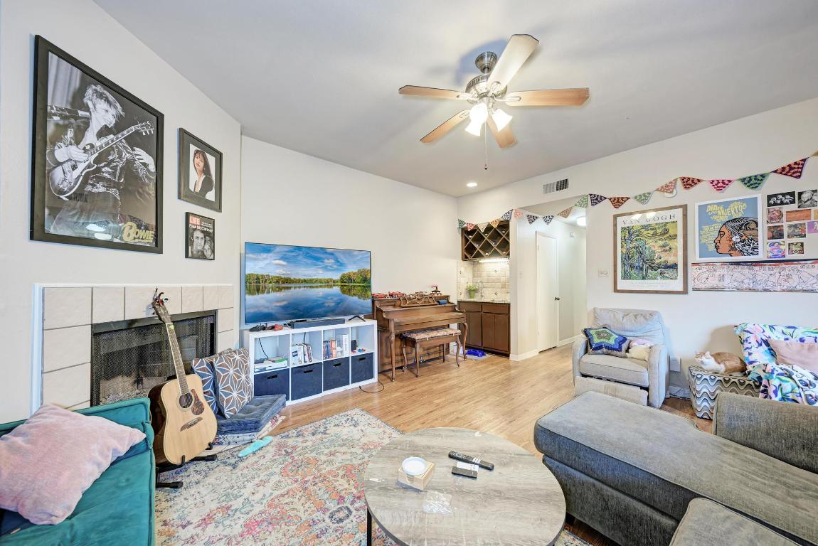 3200 Duval Street, Unit 101 Austin, TX 78705 - Photo 12 of 39 a living room with furniture and a fireplace