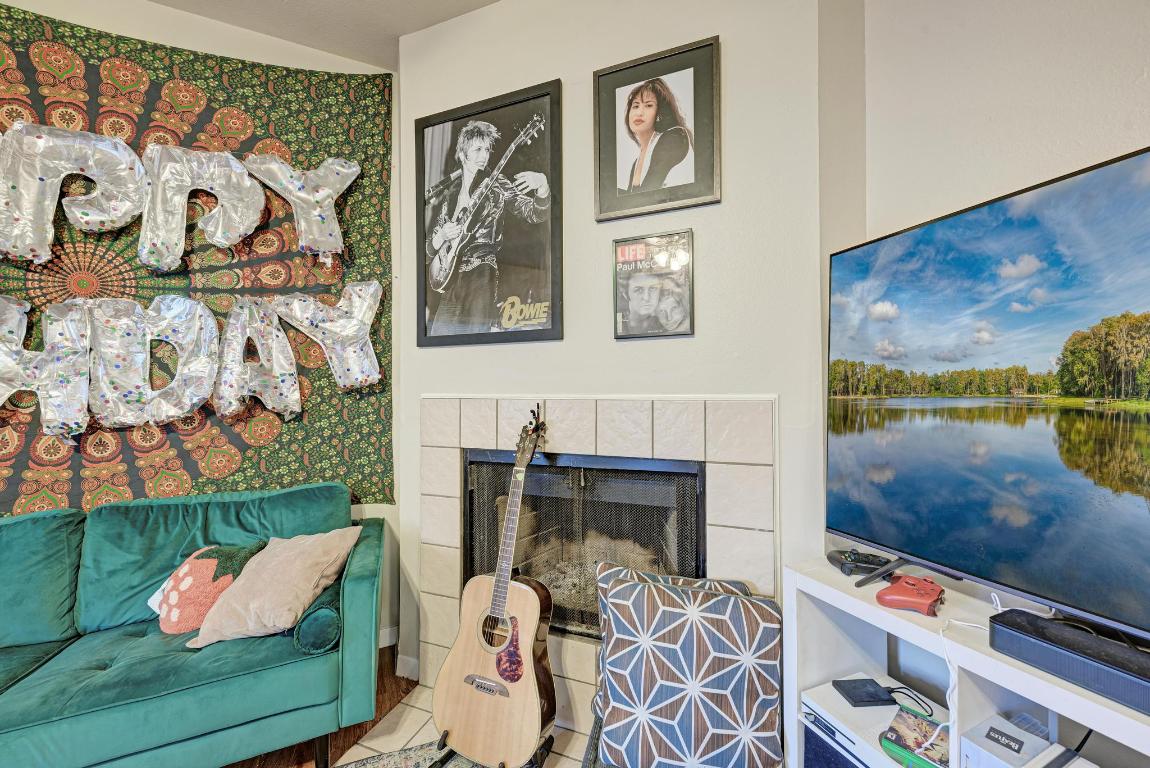 3200 Duval Street, Unit 101 Austin, TX 78705 - Photo 14 of 39 a living room with furniture and a fireplace