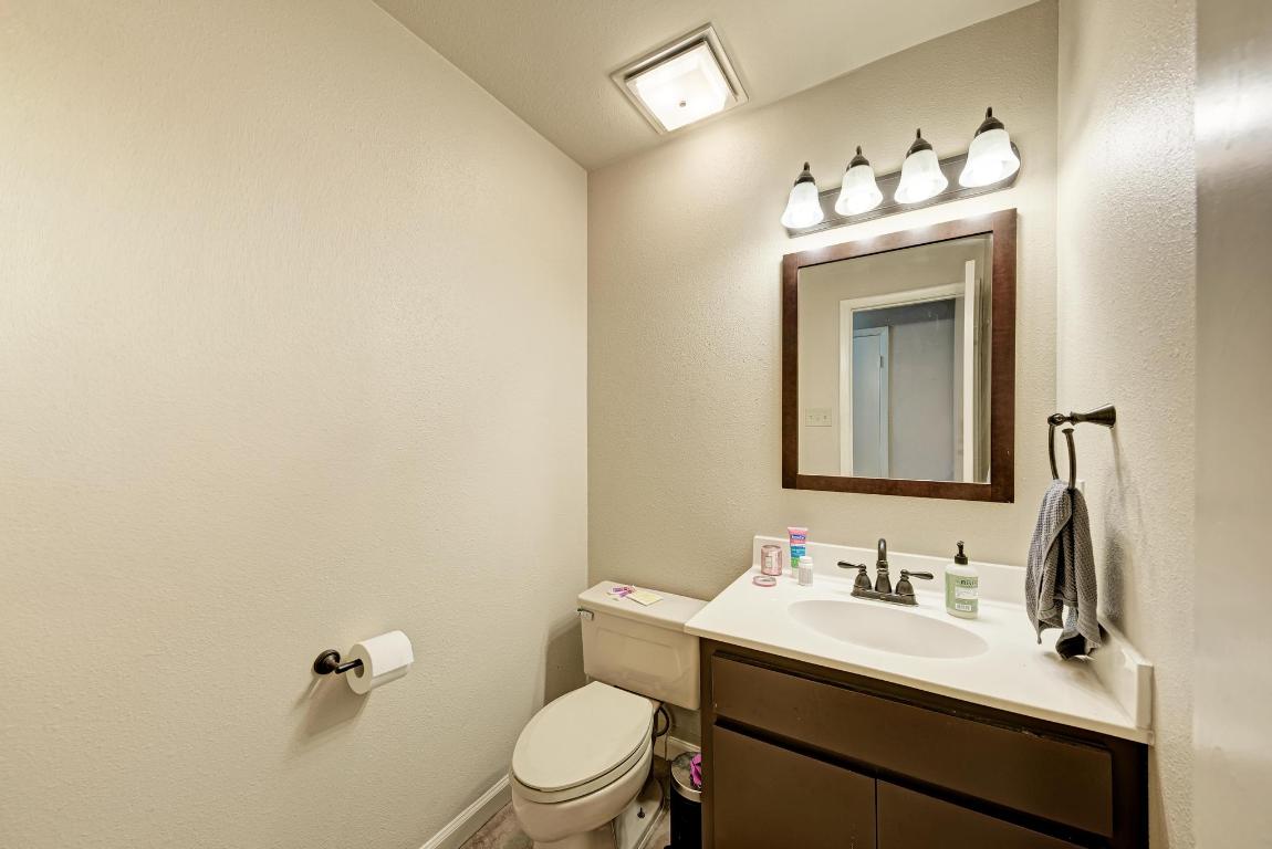 3200 Duval Street, Unit 101 Austin, TX 78705 - Photo 26 of 39 a bathroom with a toilet sink and mirror