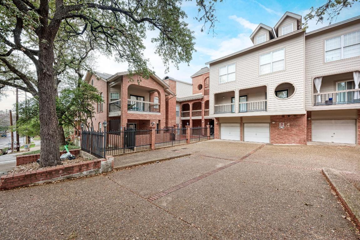 3200 Duval Street, Unit 101 Austin, TX 78705 - Photo 3 of 39 a front view of a house with a large tree