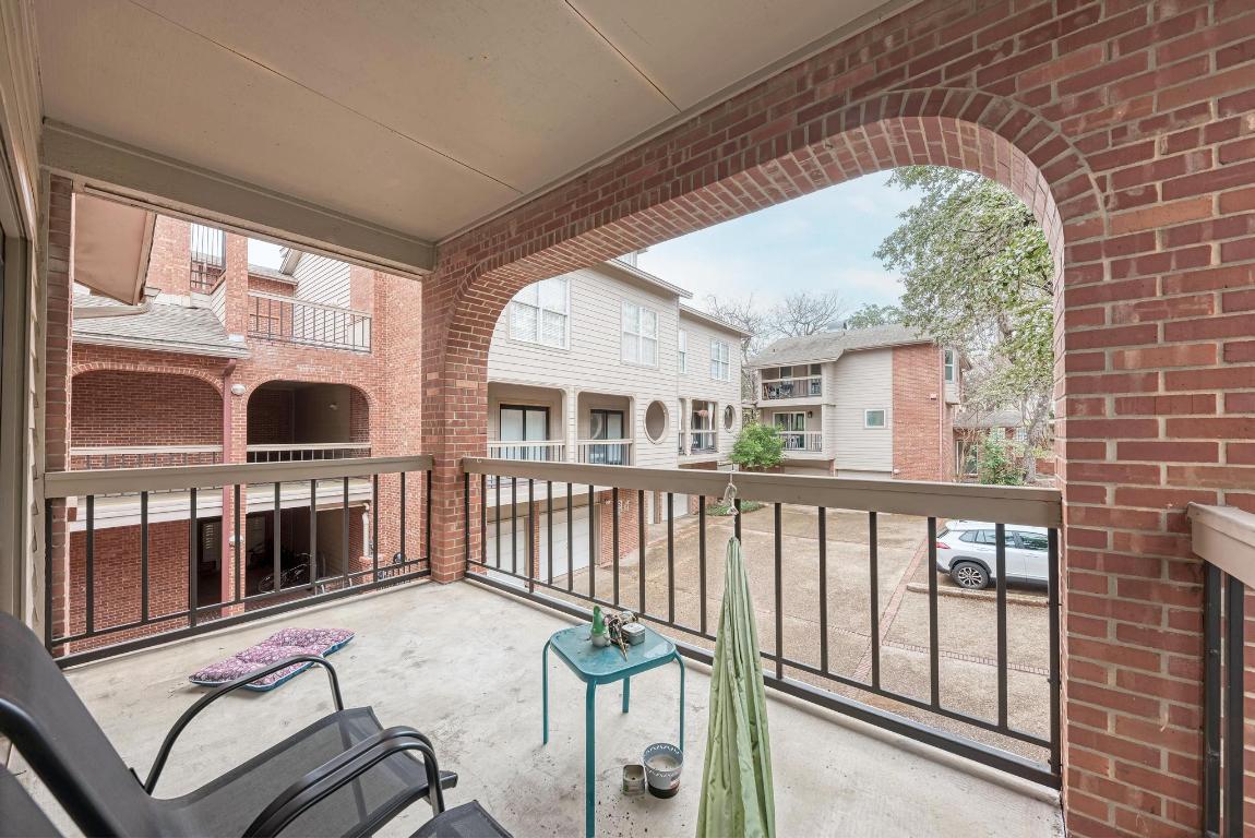 3200 Duval Street, Unit 101 Austin, TX 78705 - Photo 37 of 39 a view of balcony with a large window and wooden floor