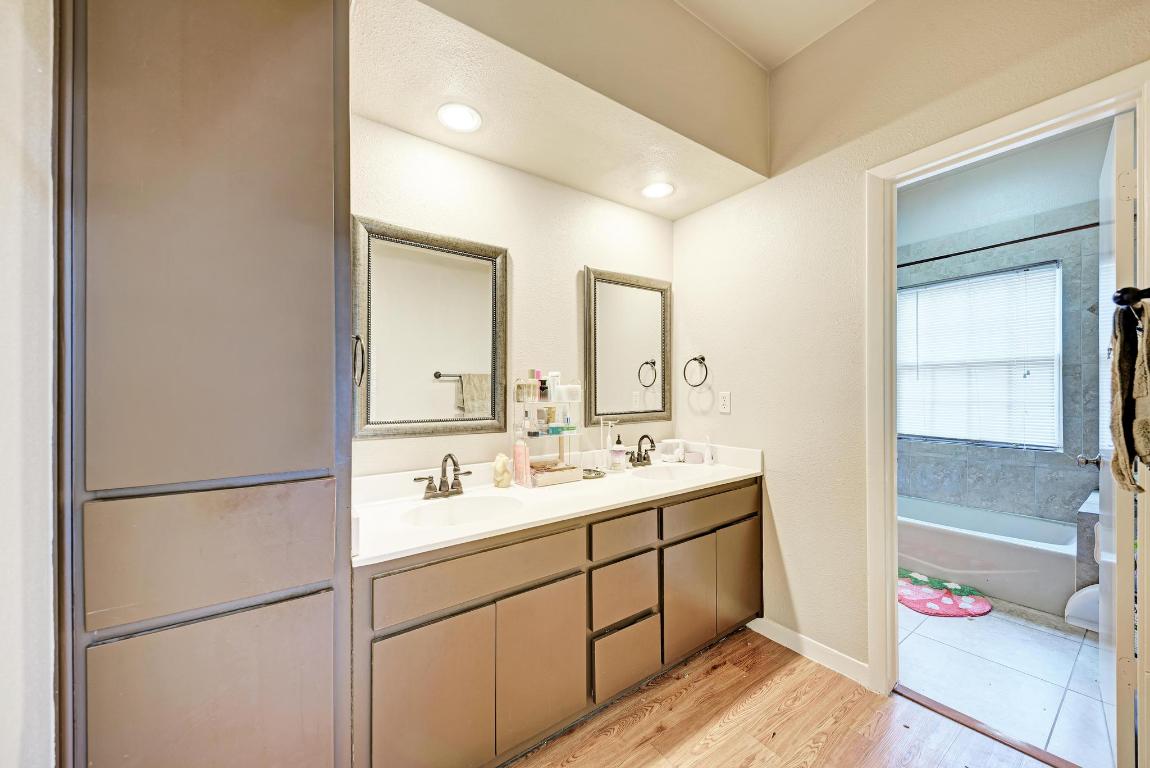 3200 Duval Street, Unit 101 Austin, TX 78705 - Photo 38 of 39 a bathroom with a double vanity sink mirror and