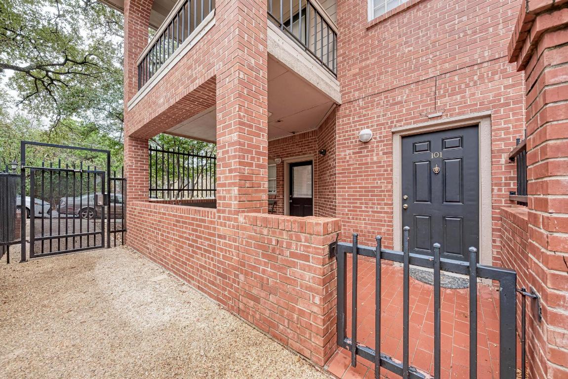 3200 Duval Street, Unit 101 Austin, TX 78705 - Photo 6 of 39 a view of a brick house with large windows