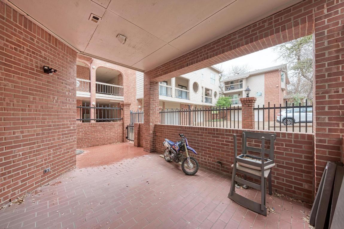 3200 Duval Street, Unit 101 Austin, TX 78705 - Photo 8 of 39 a backyard of a house with barbeque oven table and chairs