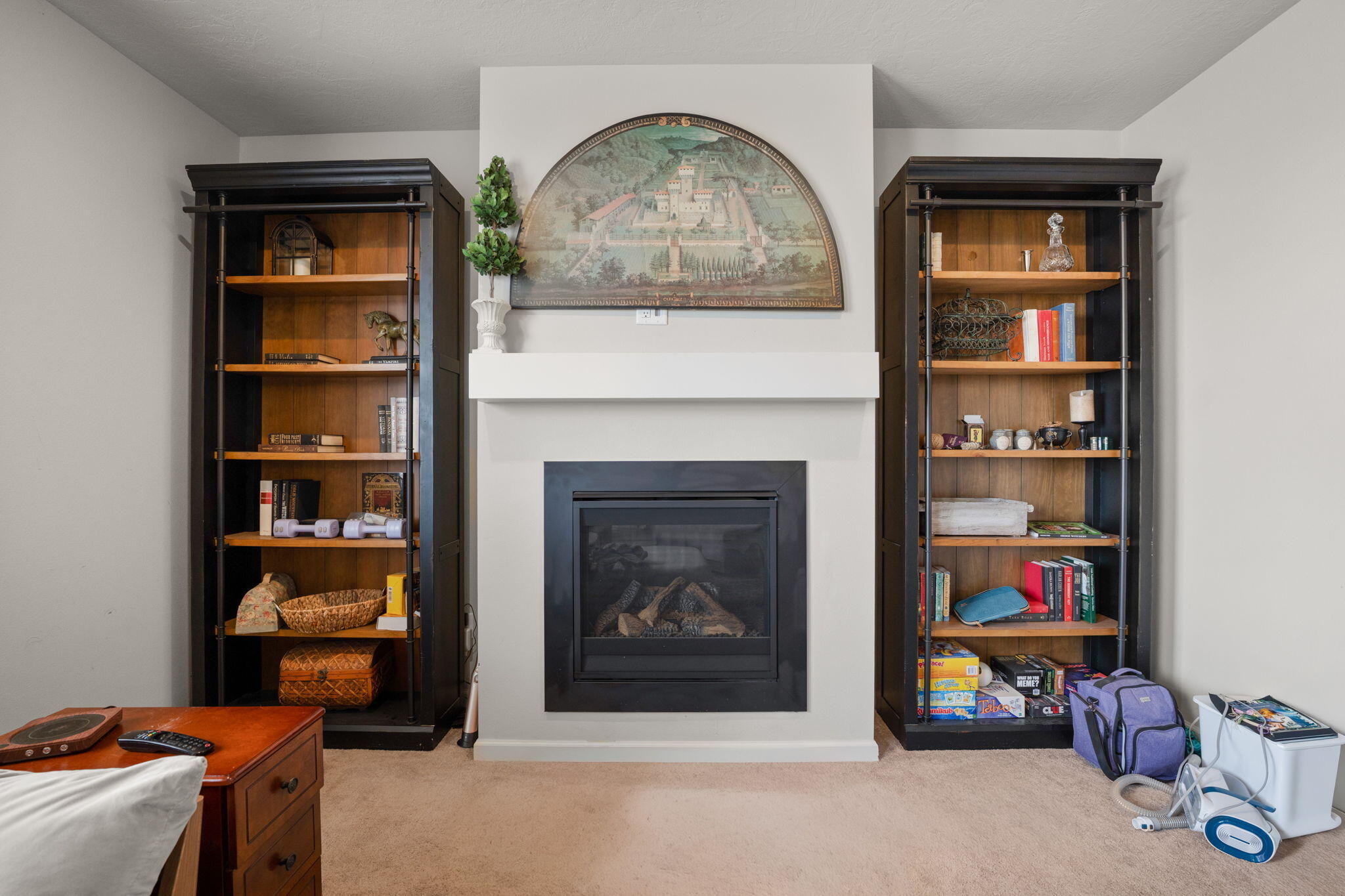 4039 Southwest Quartz Place Redmond, OR 97756 - Photo 20 of 44 a living room with fish tank and a fireplace