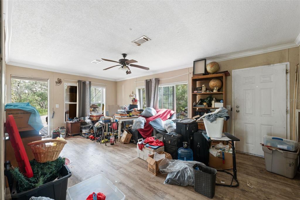 17221 Nicks Drive Spring Hill, FL 34610 - Photo 13 of 33 a living room with furniture and a window