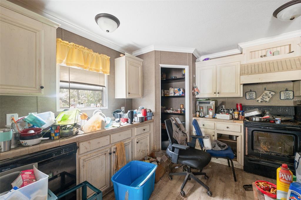 17221 Nicks Drive Spring Hill, FL 34610 - Photo 15 of 33 a view of a kitchen with workspace and a window