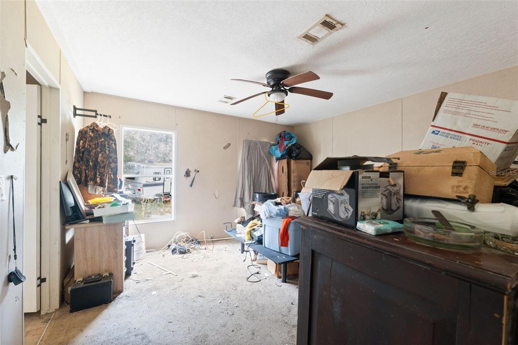 17221 Nicks Drive Spring Hill, FL 34610 - Photo 18 of 33 a bedroom with furniture and a gym equipment