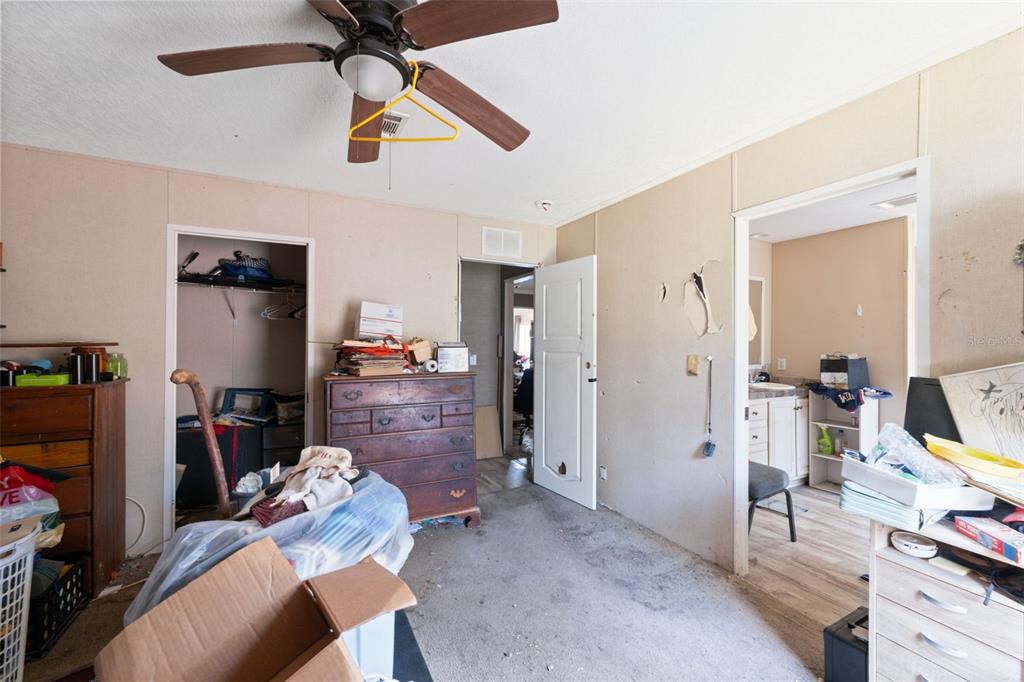17221 Nicks Drive Spring Hill, FL 34610 - Photo 19 of 33 a living room with furniture and a flat screen tv