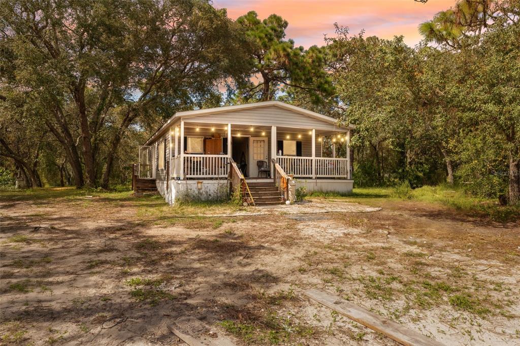 17221 Nicks Drive Spring Hill, FL 34610 - Photo 2 of 33 a front view of a house with a yard