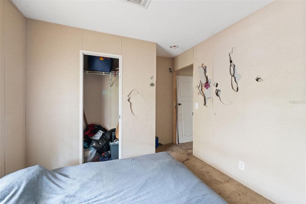 17221 Nicks Drive Spring Hill, FL 34610 - Photo 23 of 33 a view of a bedroom with bed and closet