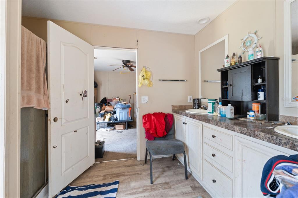 17221 Nicks Drive Spring Hill, FL 34610 - Photo 24 of 33 a spacious bathroom with stainless steel appliances granite countertop a sink and a refrigerator