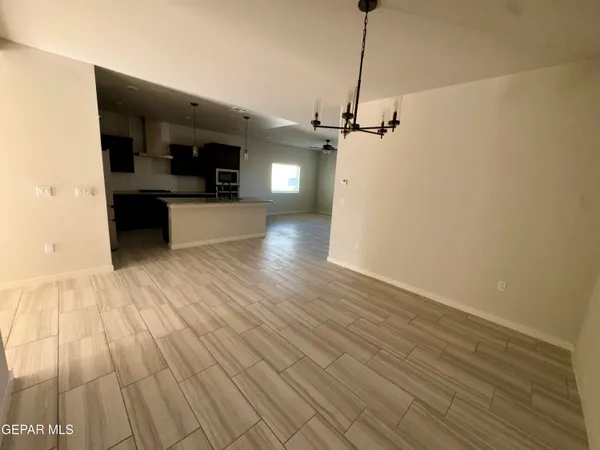 a view of a living room with wooden floor