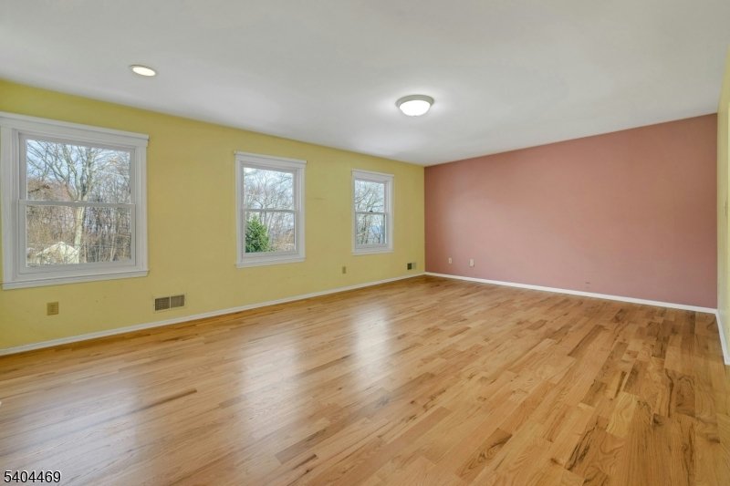 40 White Meadow Road Rockaway, NJ 07866 - Photo 21 of 41 a view of empty room with wooden floor and fan