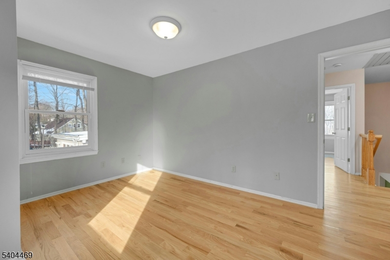 40 White Meadow Road Rockaway, NJ 07866 - Photo 31 of 41 a view of empty room with wooden floor