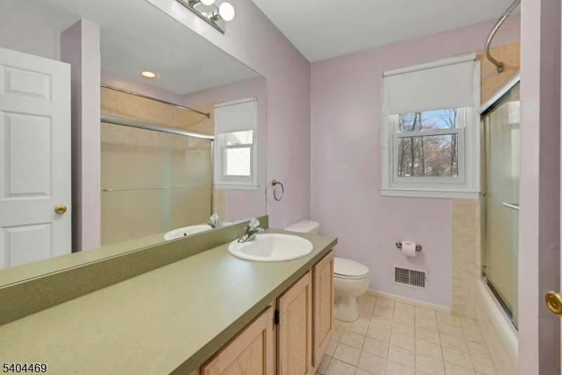 40 White Meadow Road Rockaway, NJ 07866 - Photo 35 of 41 a bathroom with a granite countertop sink toilet and shower