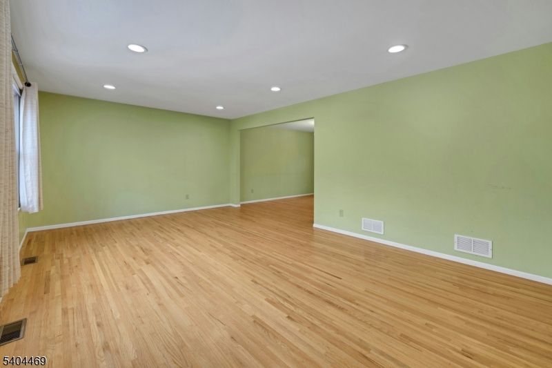 40 White Meadow Road Rockaway, NJ 07866 - Photo 8 of 41 a view of empty room with wooden floor