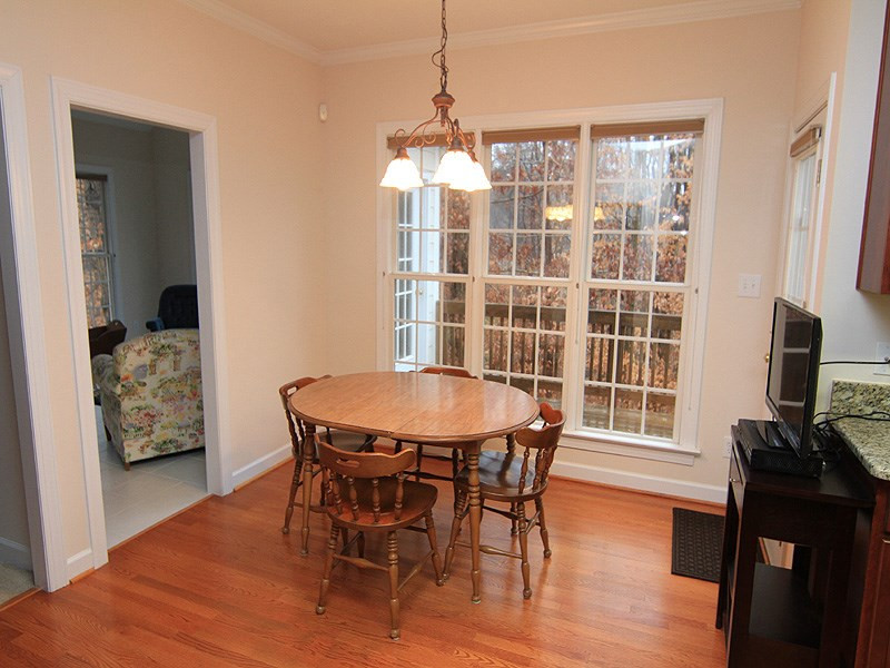 2937 Sunnystone Way Raleigh, NC 27613 - Photo 13 of 25 Hardwood floors, great natural lighting, Crown Molding are featured. Breakfast Area