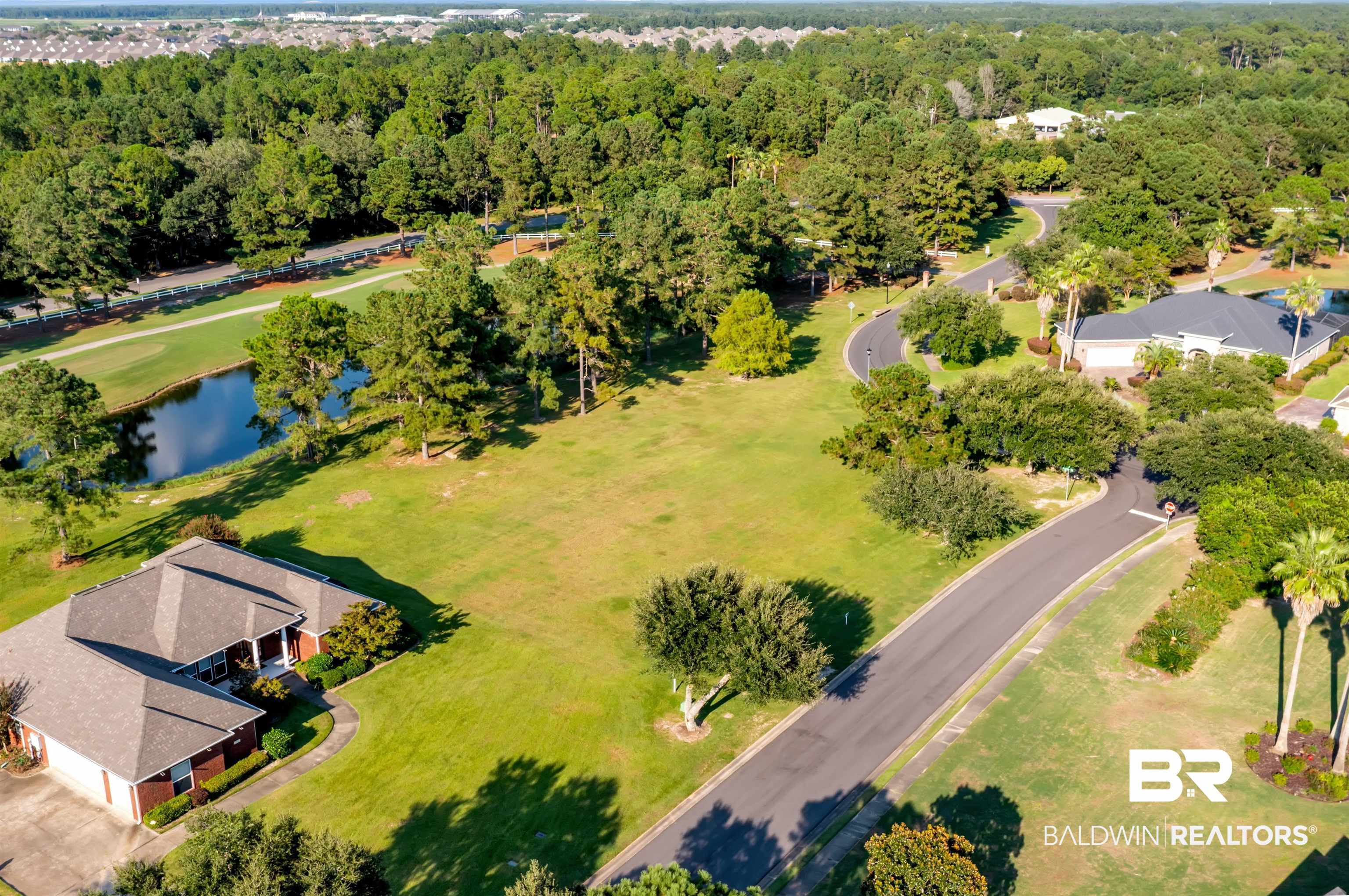 Lakes Circle Gulf Shores, AL 36542 - Photo 6 of 15 Bird's eye view of a nearby body of water and a local golf course