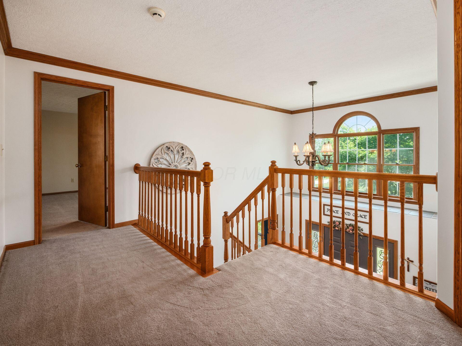 7941 Steitz Road Powell, OH 43065 - Photo 15 of 24 The upstairs landing is spacious and the beautiful Pella windows give it lots of natural light.