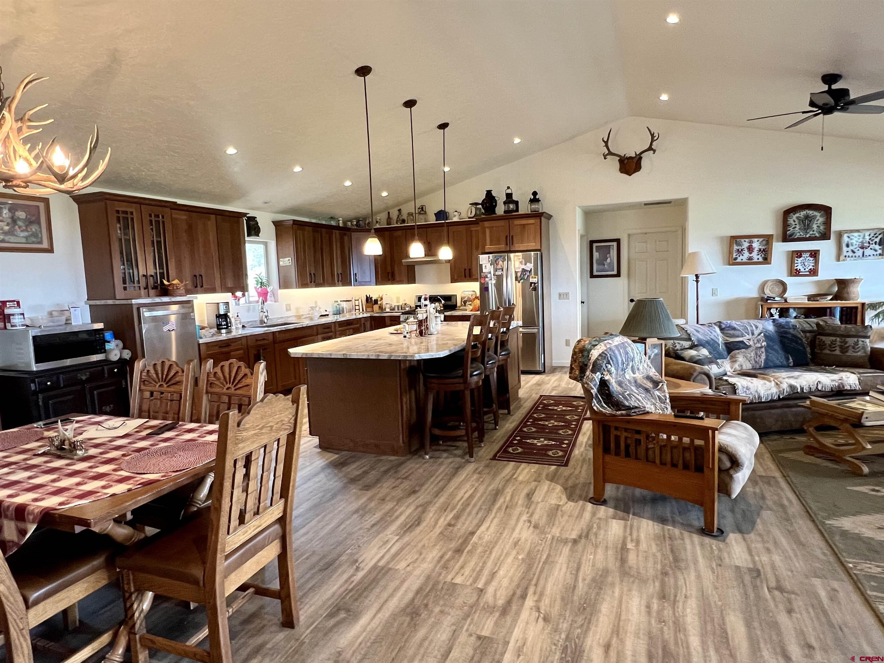 23105 U Road Cedaredge, CO 81413 - Photo 11 of 33 a kitchen with a table chairs and wooden floor