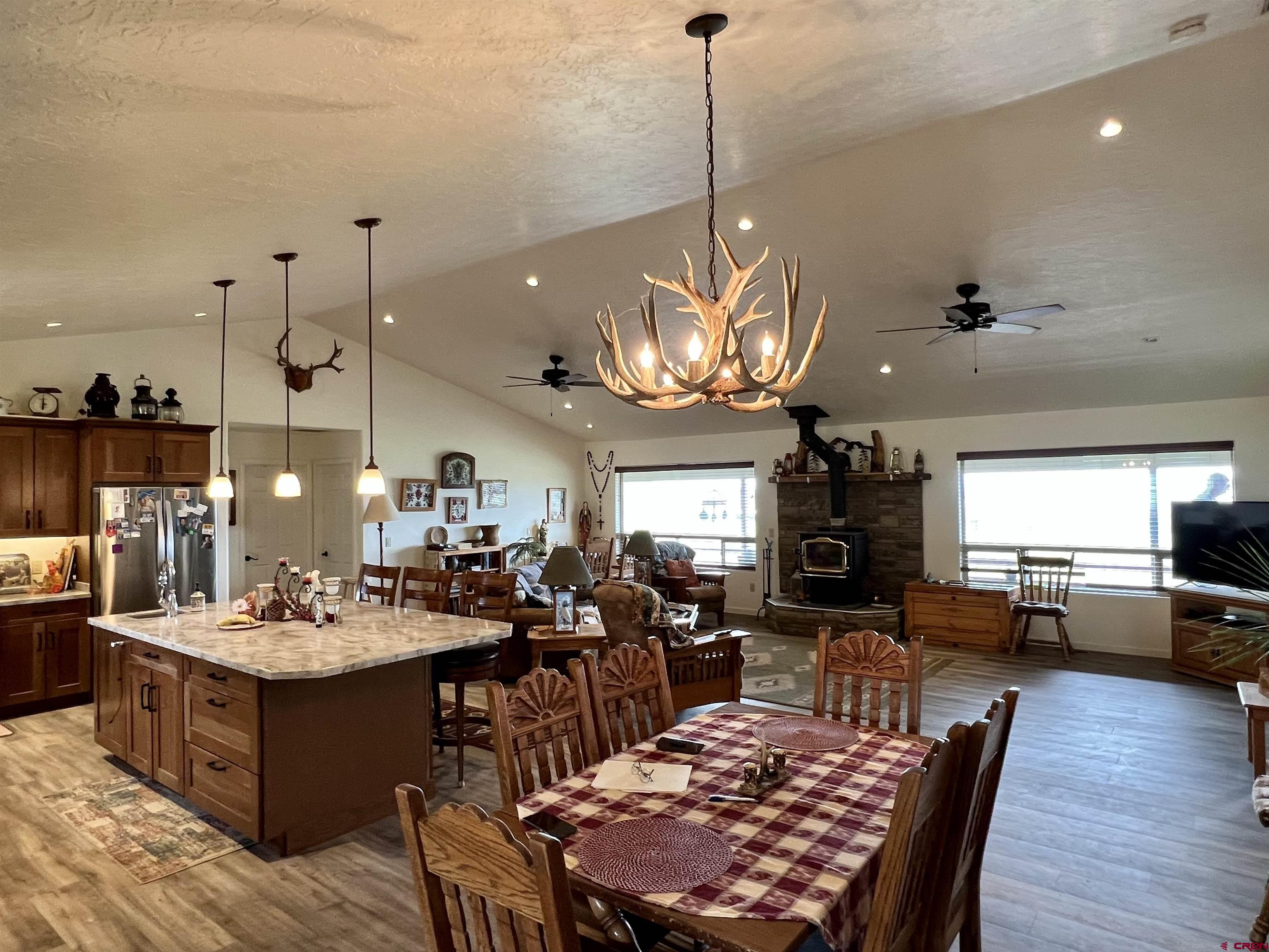 23105 U Road Cedaredge, CO 81413 - Photo 12 of 33 a large kitchen with a table and chairs