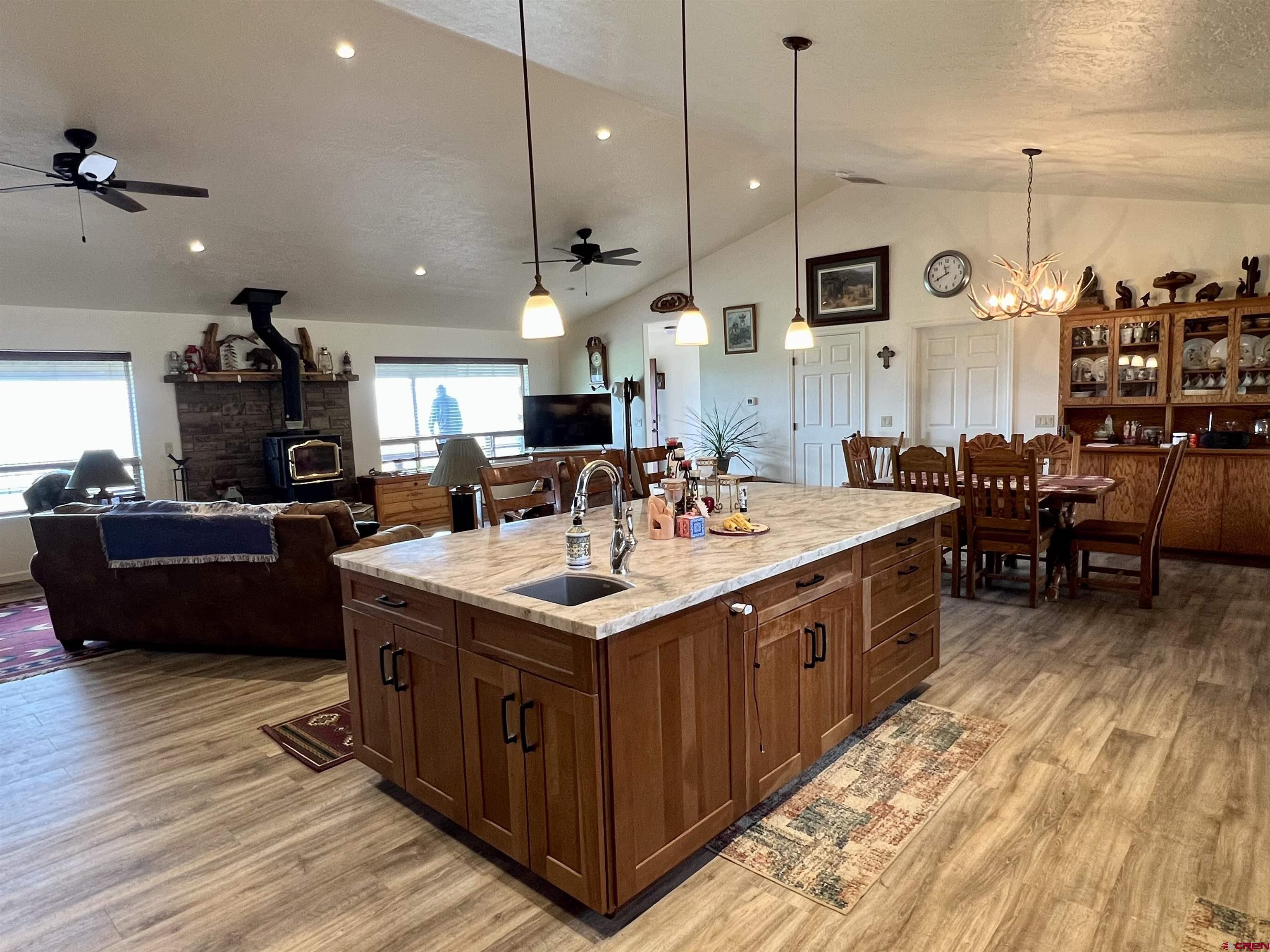 23105 U Road Cedaredge, CO 81413 - Photo 18 of 33 a kitchen with stainless steel appliances kitchen island a large island in the center