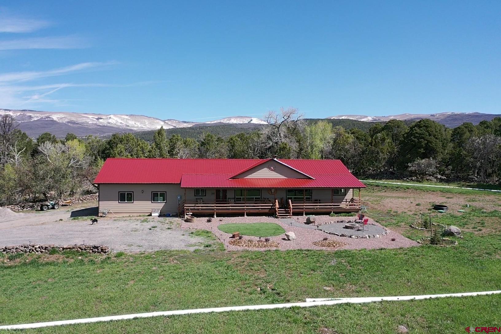 23105 U Road Cedaredge, CO 81413 - Photo 2 of 33 a view of a big yard with table and chairs