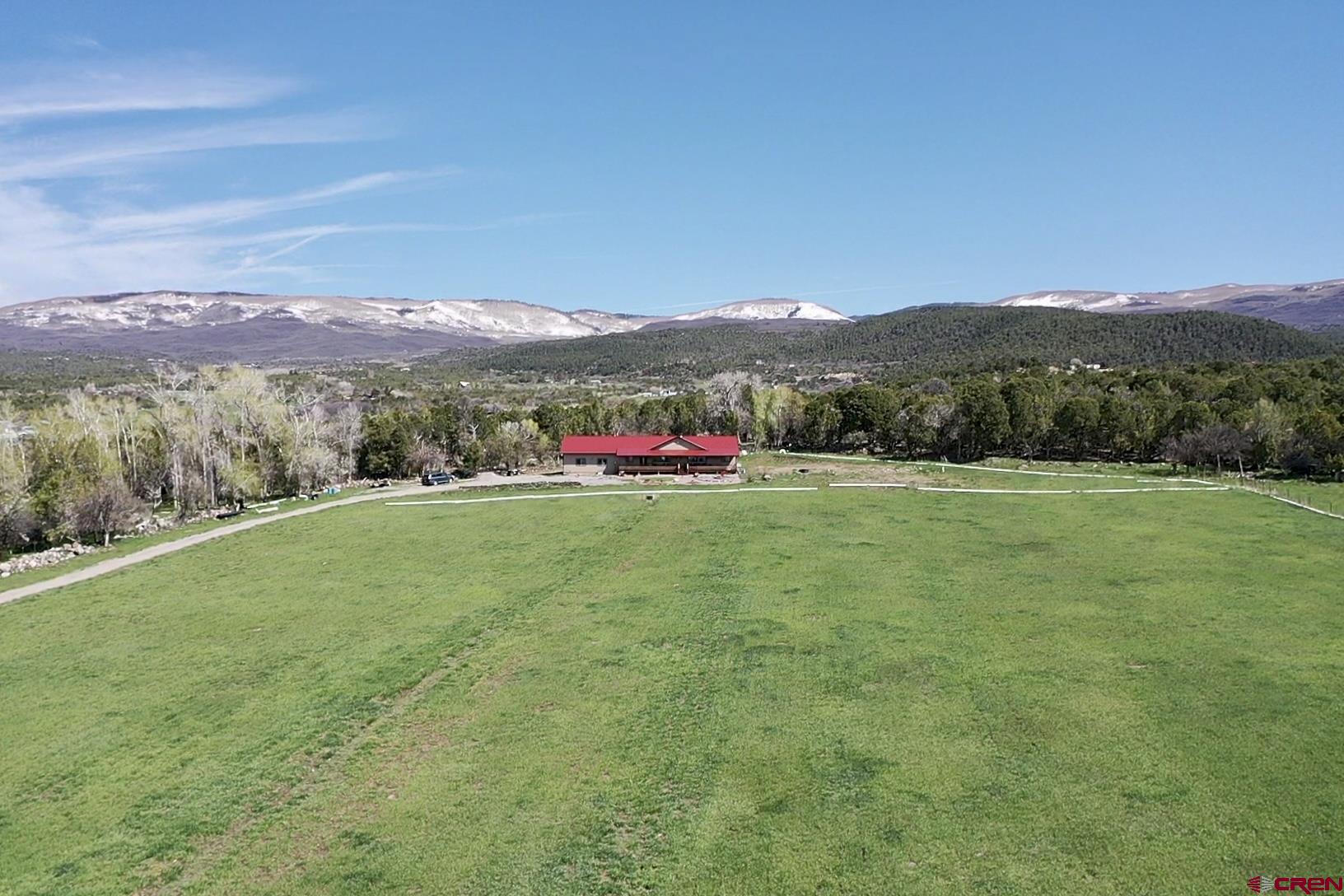 23105 U Road Cedaredge, CO 81413 - Photo 29 of 33 a view of lake with mountain in the background